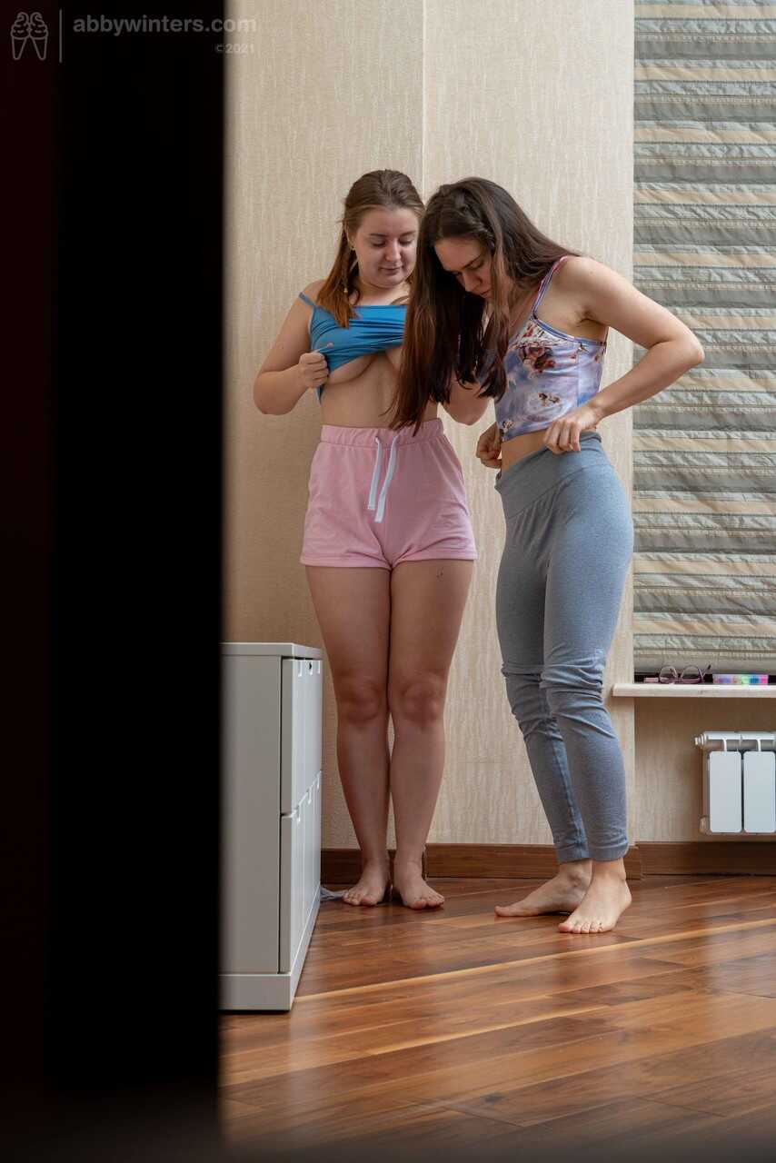 Cute teens Anca and Galina get spied on while dressing their natural tits and small asses in short booty shorts, and end u...