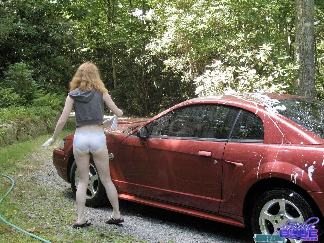 Amateur teen Nicki Blue unveils her tight tits and hot pussy as she washes her car!