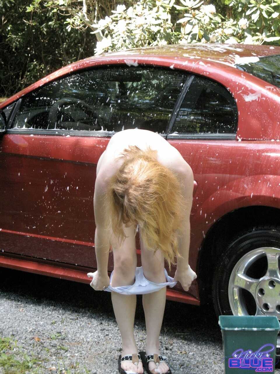 Amateur teen Nicki Blue unveils her tight tits and hot pussy as she washes her car! 