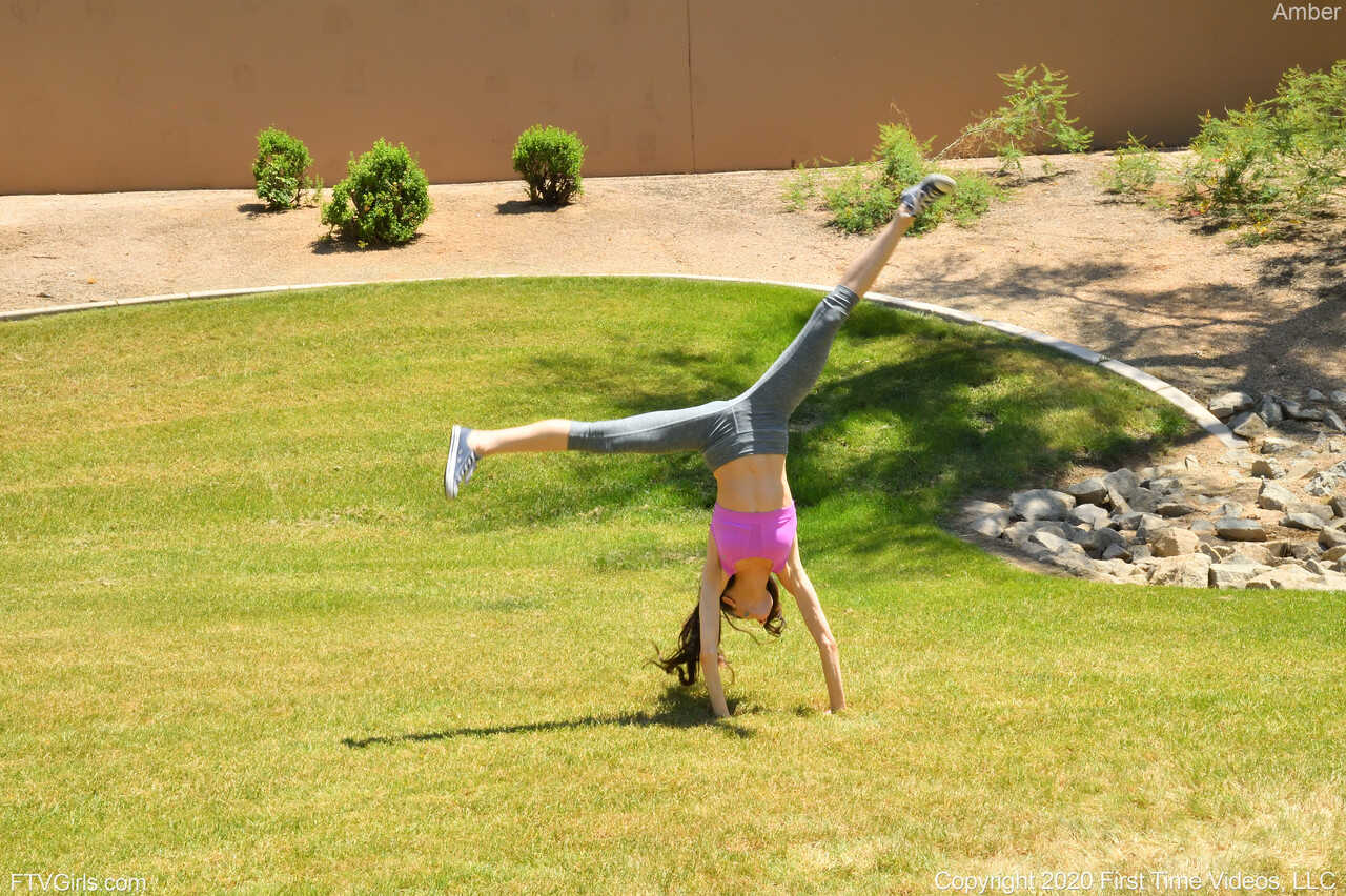 Flexible Amber Wildee loses her yoga pants and toys her puffy brunette pussy. - Amber Wildee