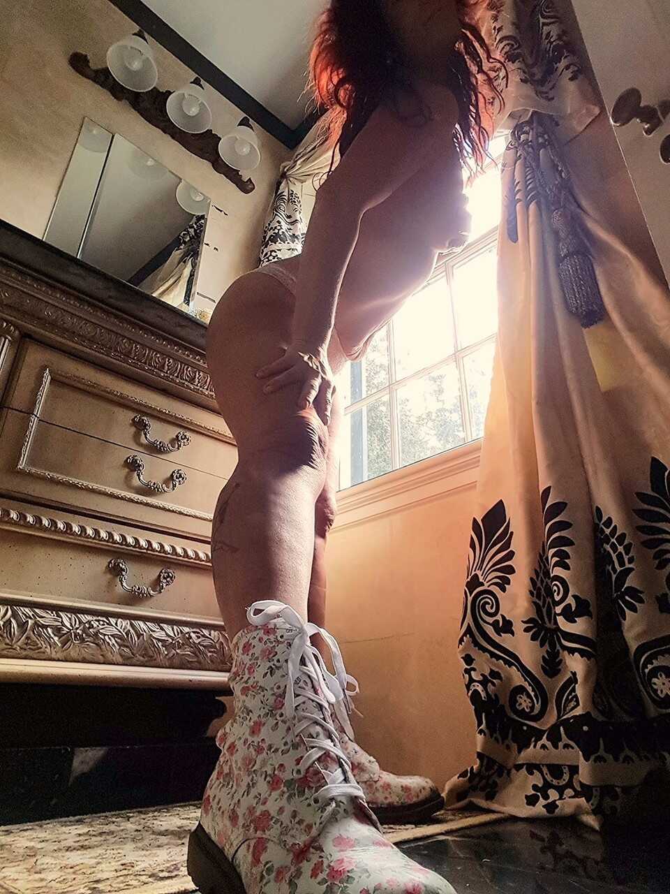 Redheaded Italian MILF Lady Scarlet in her hot shoes strips down and shows off her tattoos - Lady Scarlet