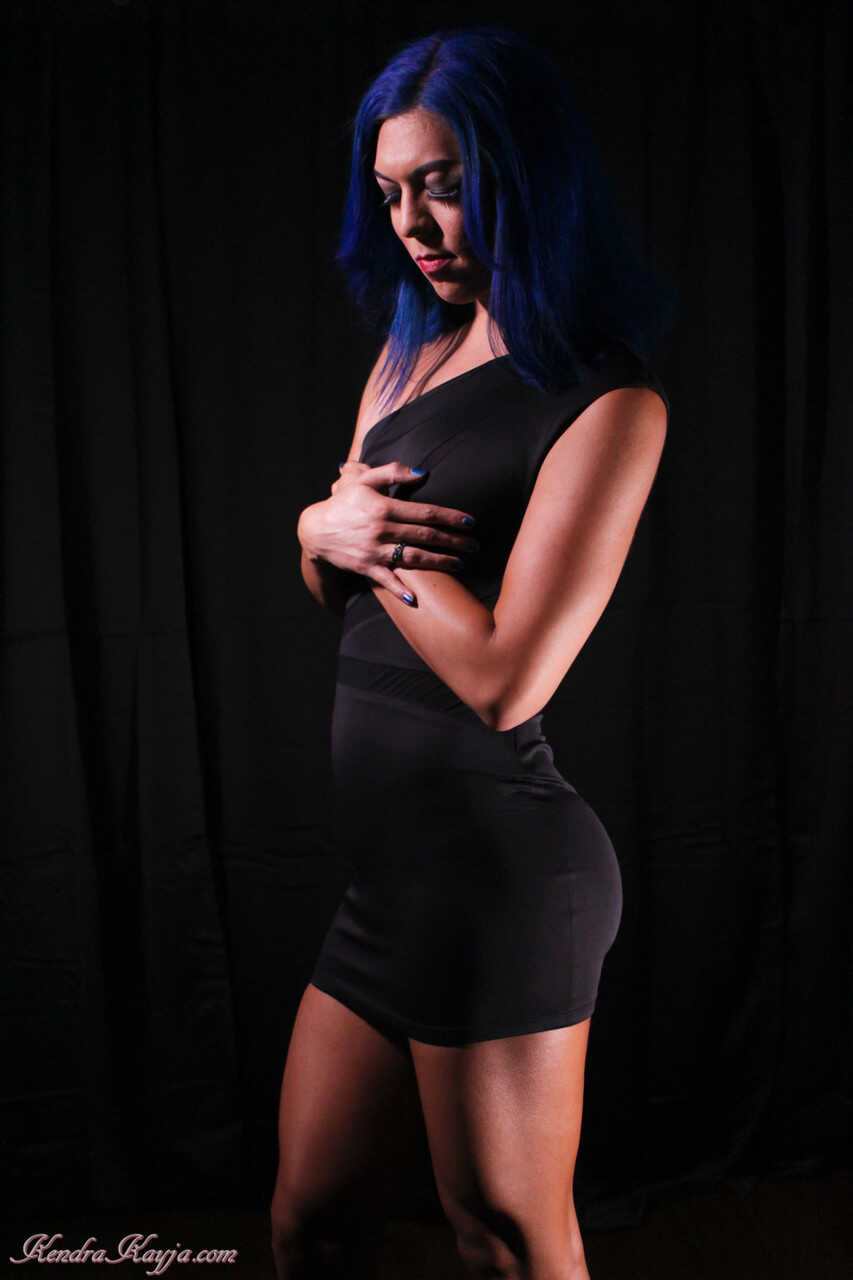 The Curvy Blue-Haired Siren Strips Down for Your Pleasure: Kendra Sinclaire's Naughty Naked Display in Black Lingerie...