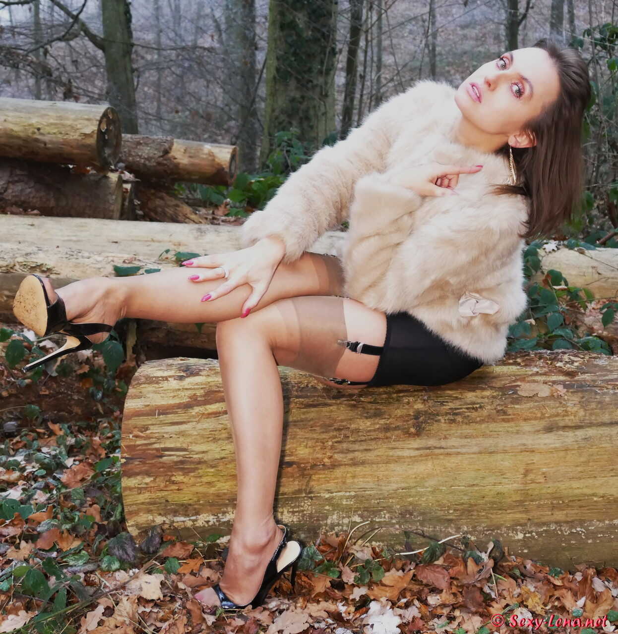 Brunette bombshell shows off her sexy stilettos and nylons in a sultry pose - Pantyhose