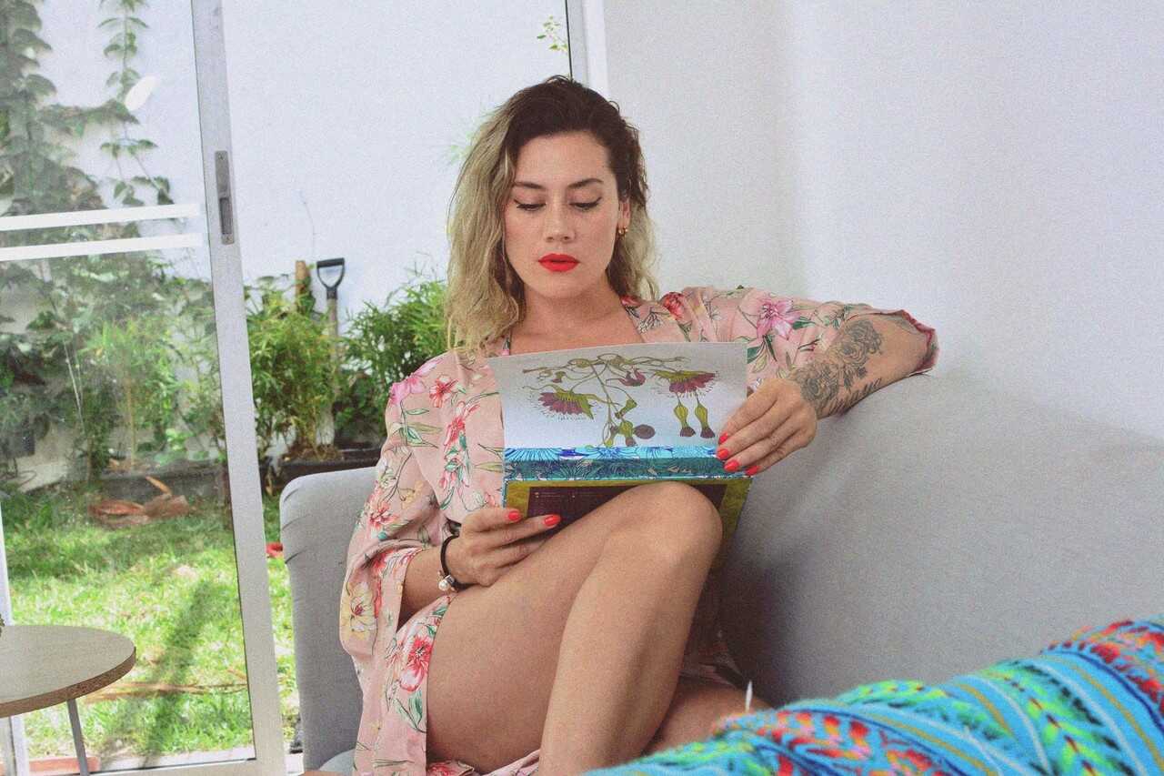 Inked MILF Andrea Garcia's Curly Blonde MILF Selfie Reveals Her Amazing Big Tits and Tan Lines While Reading on a Cou...