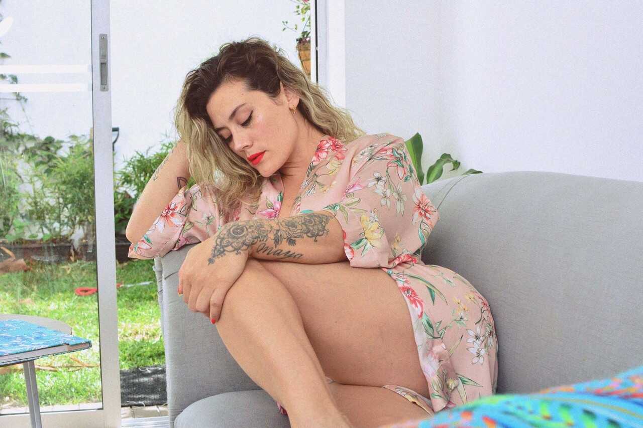 Inked MILF Andrea Garcia's Curly Blonde MILF Selfie Reveals Her Amazing Big Tits and Tan Lines While Reading on a Cou...