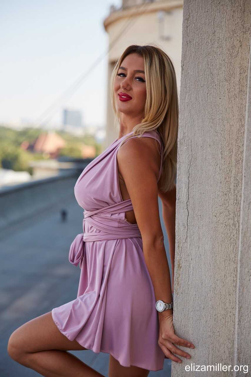 Blonde Bombshell in a Sexy Little Summer Dress Shows Off Her Long Legs - 