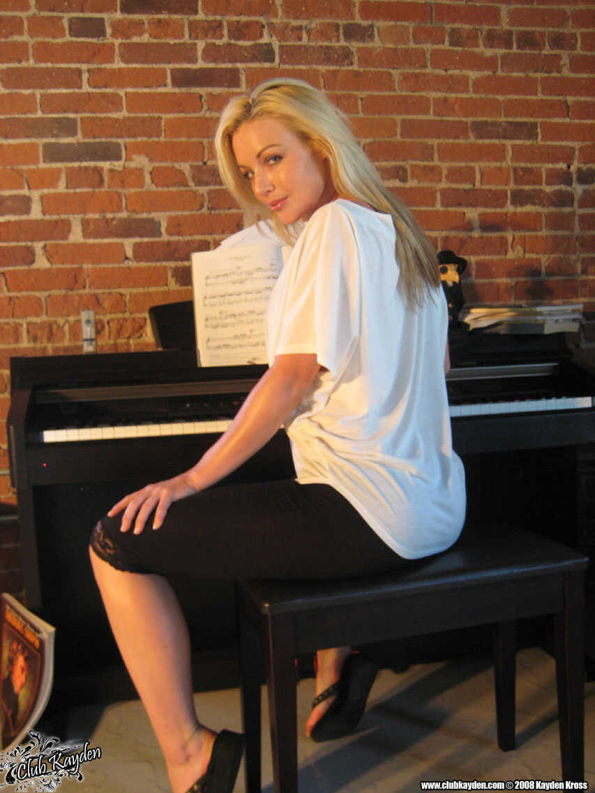 Kayden Kross, the Sexy Blonde Piano Teacher with Fake Tits and Pussy Flaunts her Nude Body for her Students