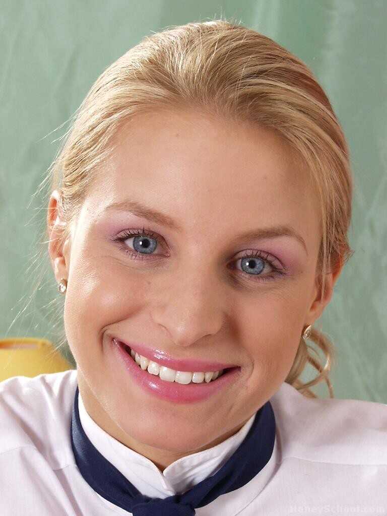 Blonde MILF Bella Menclova strips her schoolgirl uniform and shows her curves while upskirting without panties for the cam...