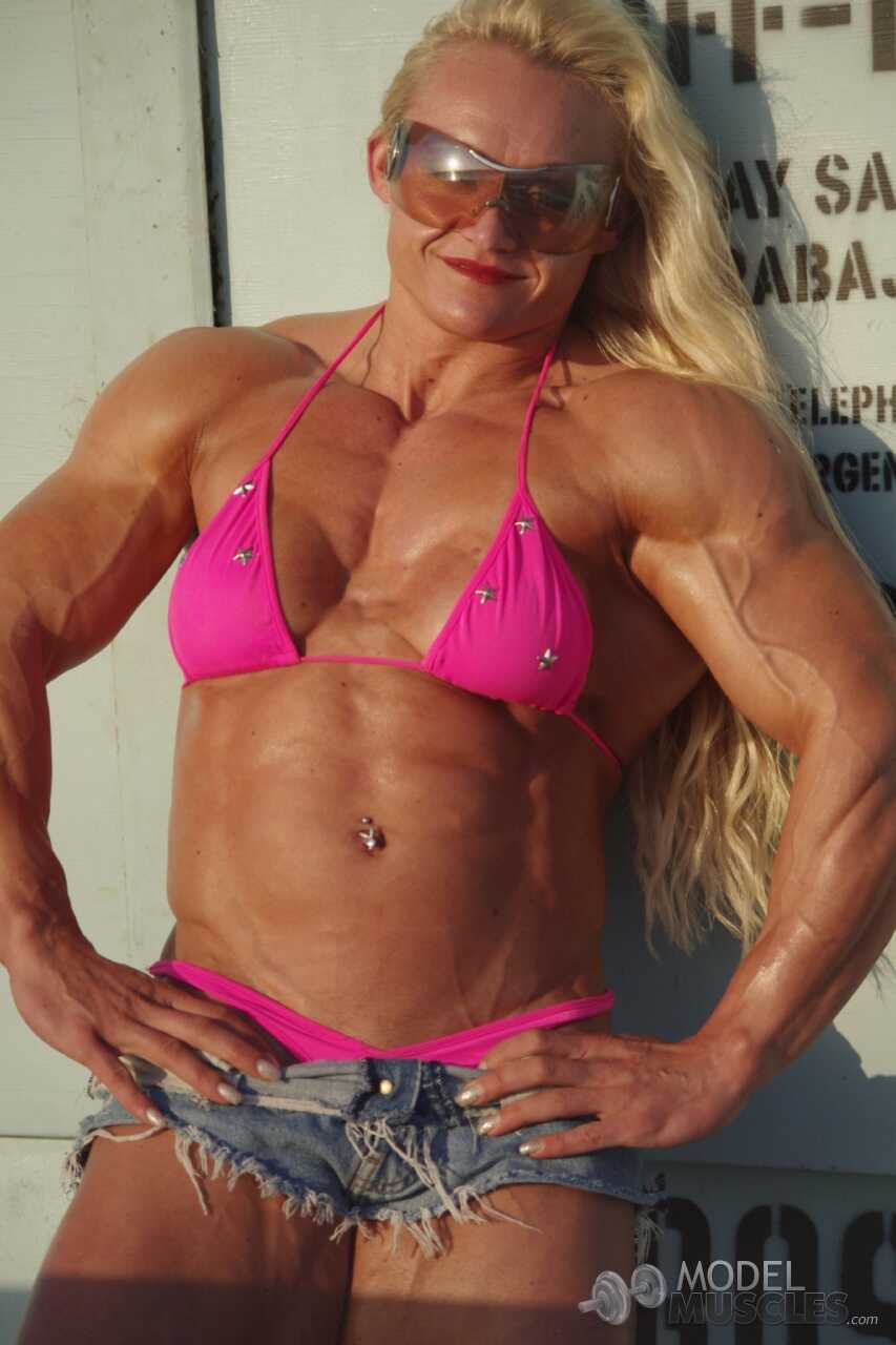 Blonde Slovenian bodybuilder Brigita Brezovac shows her muscles on the beach with a mature and sexy older woman - Brigita ...