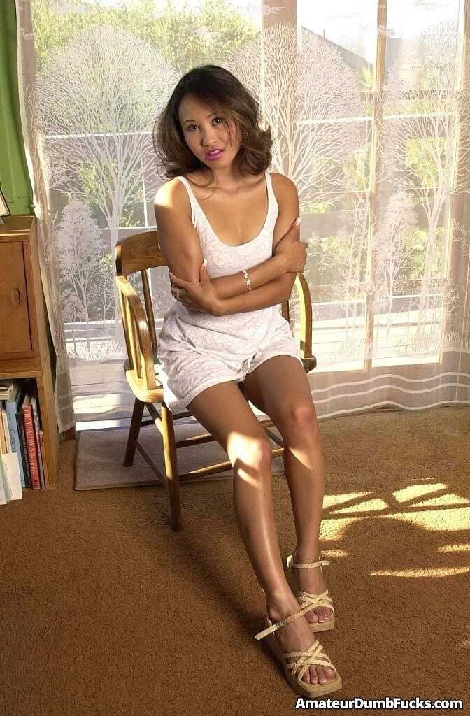 Brunette Asian Lisa Linn massages her hairy twat and shows off her big ass in a short skirt no panties upskirt, while spre...