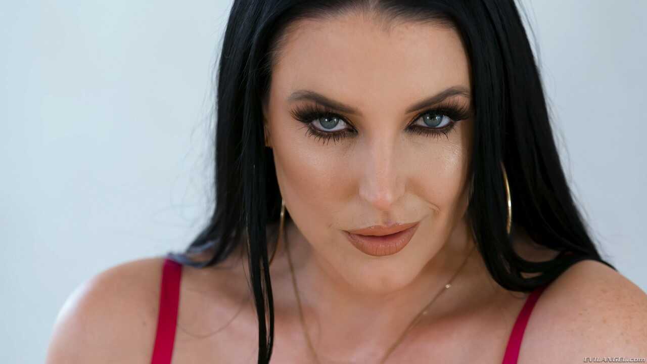 Stunning MILF Angela White pleasures a big dick with her lubed big tits and titfucks Jonni Darkko in this sexy porn image....
