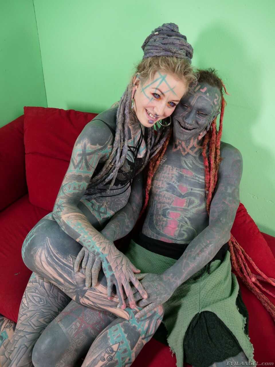 Tattooed German model Anuskatzz shows her big booty and masturbates with her long legs spread wide open while exposing her...