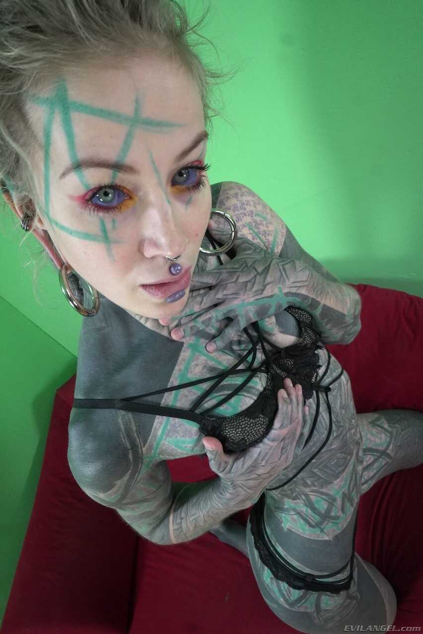 Tattooed German model Anuskatzz shows her big booty and masturbates with her long legs spread wide open while exposing her...