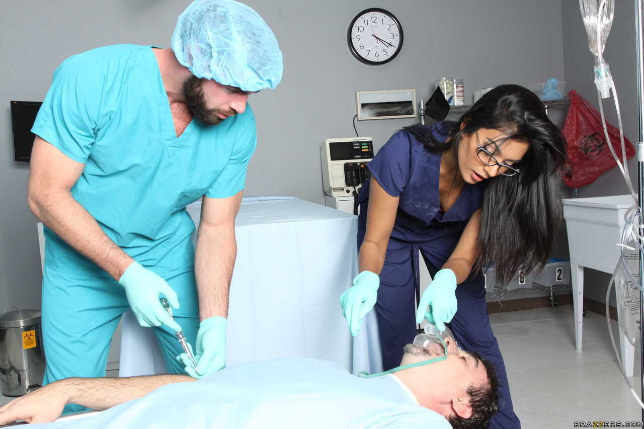 Black haired nurse Shazia Sahari gets her mouth and pussy banged by a doctor while wearing sexy lingerie gloves A dark-nip...
