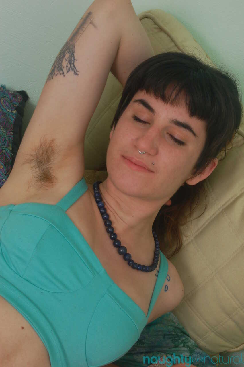 Short-haired amateur Joey Minx flaunts her feet & hairy body parts on the bed while masturbating in sexy panties and h...