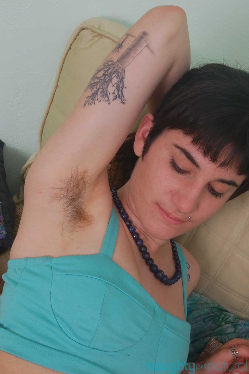 Short-haired amateur Joey Minx flaunts her feet & hairy body parts on the bed while masturbating in sexy panties and h...