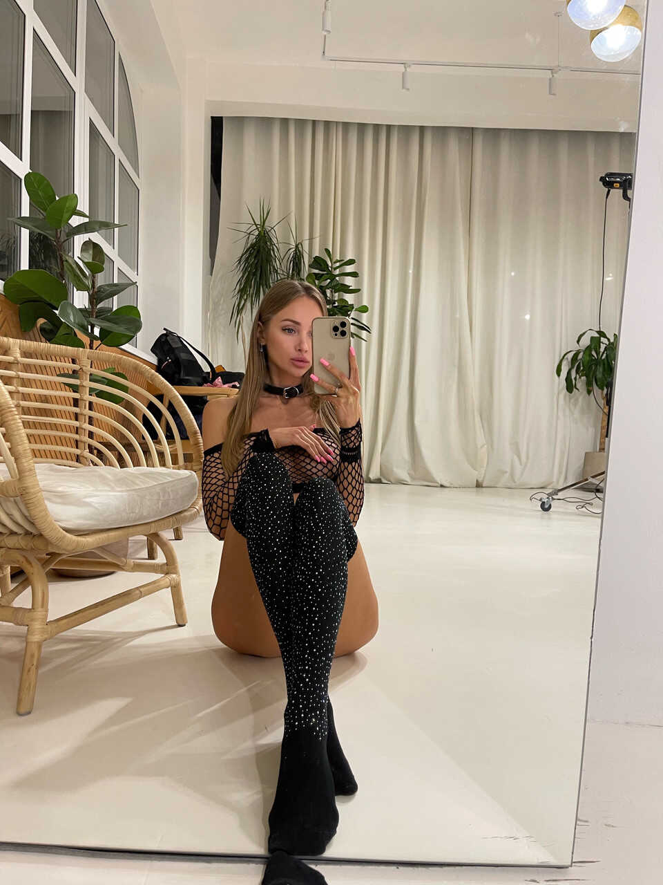 Blonde Beauty Teases with her Big Tits on a Couch while Wearing Fishnets and Sexy Lingerie . - 