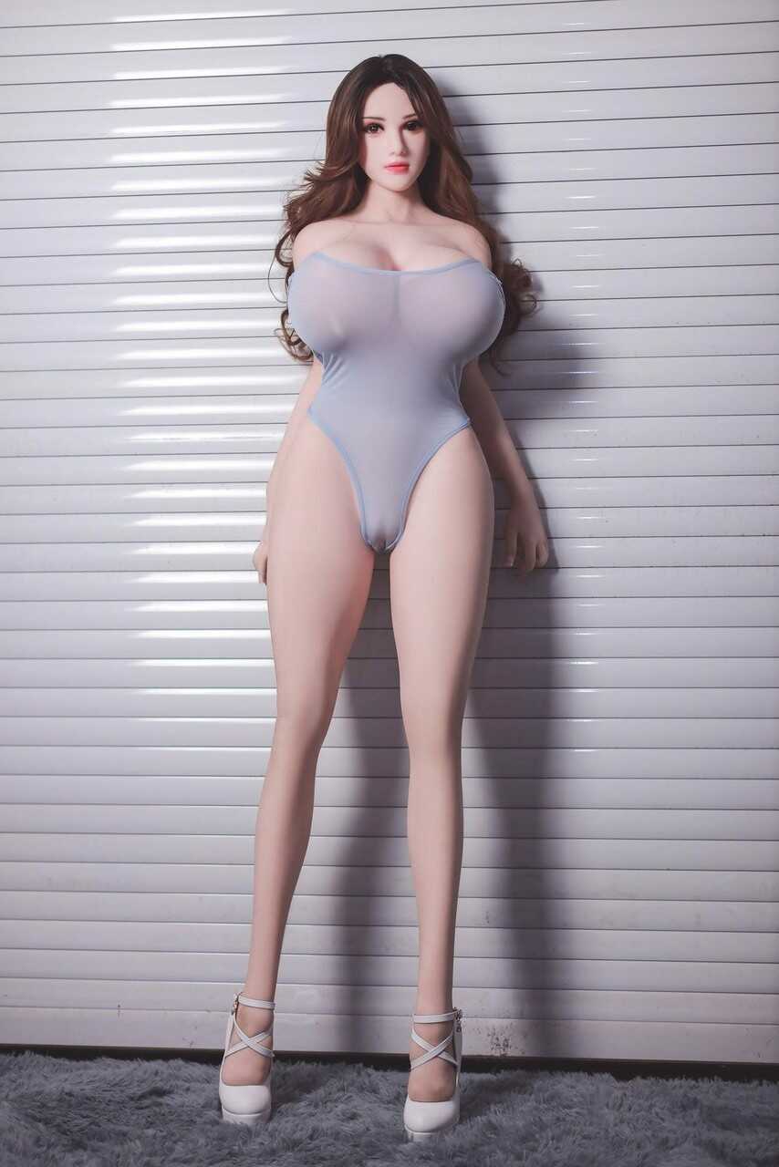 Big Boobs Babe Erica Poses In A Tight Bodysuit And Teases With Her Huge Knockers - 