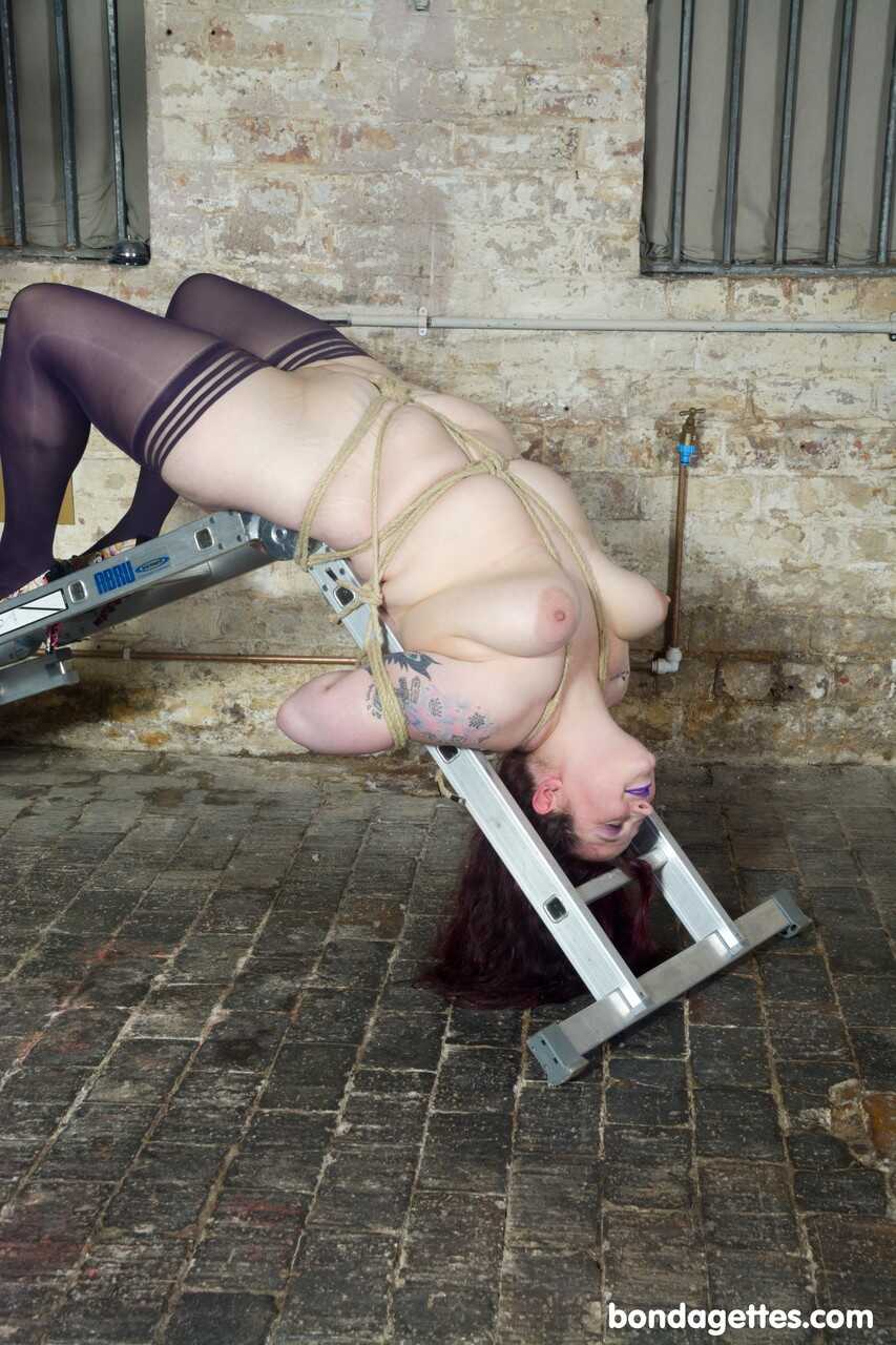Redheaded Fatty Slavegirl Emma Gets Tied up in a Steel Bondage Construction with Chubby Kinky Fun - Slavegirl Emma