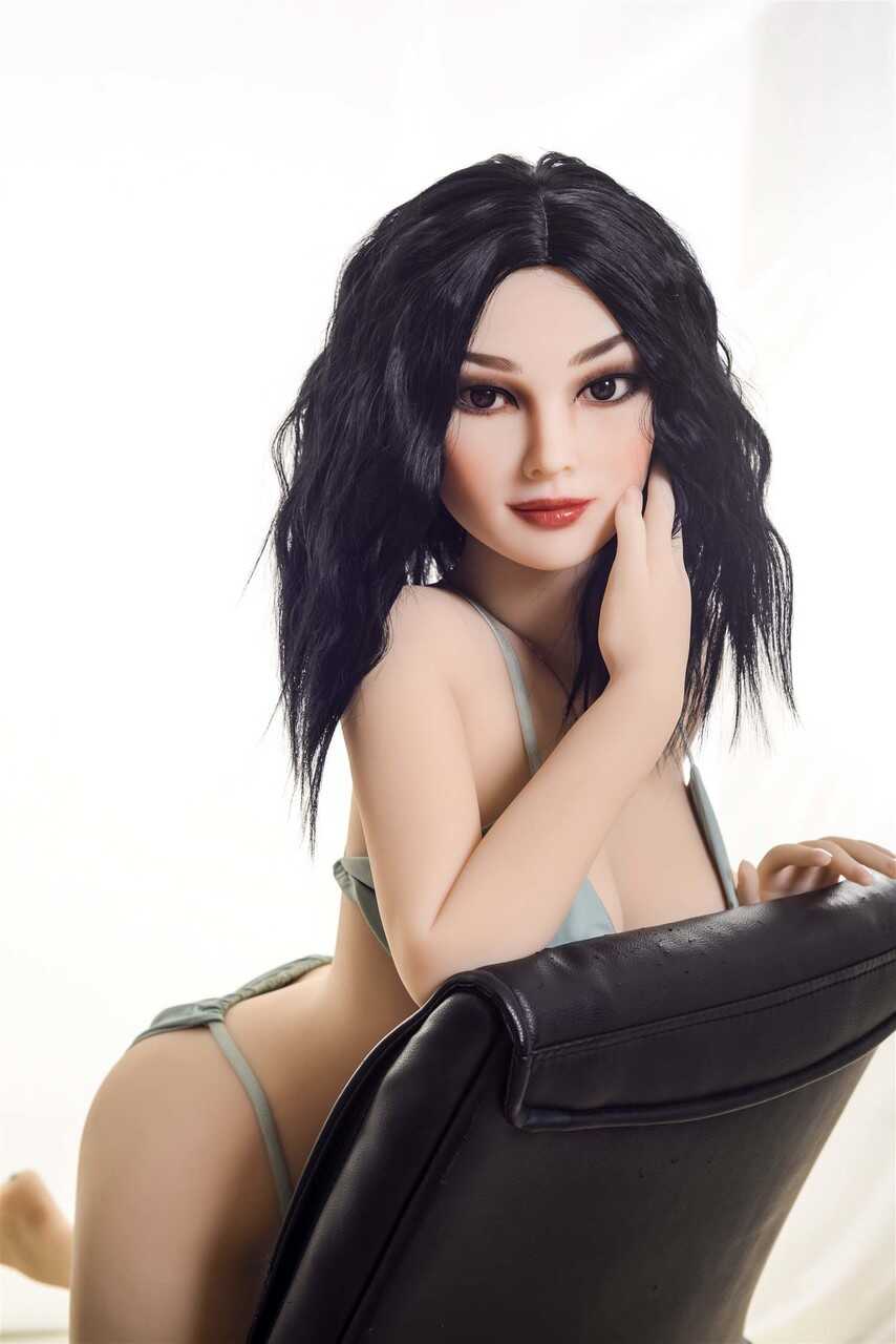 Raven-haired sex doll Coral gets rid of her bikini & poses naked in a chair - 