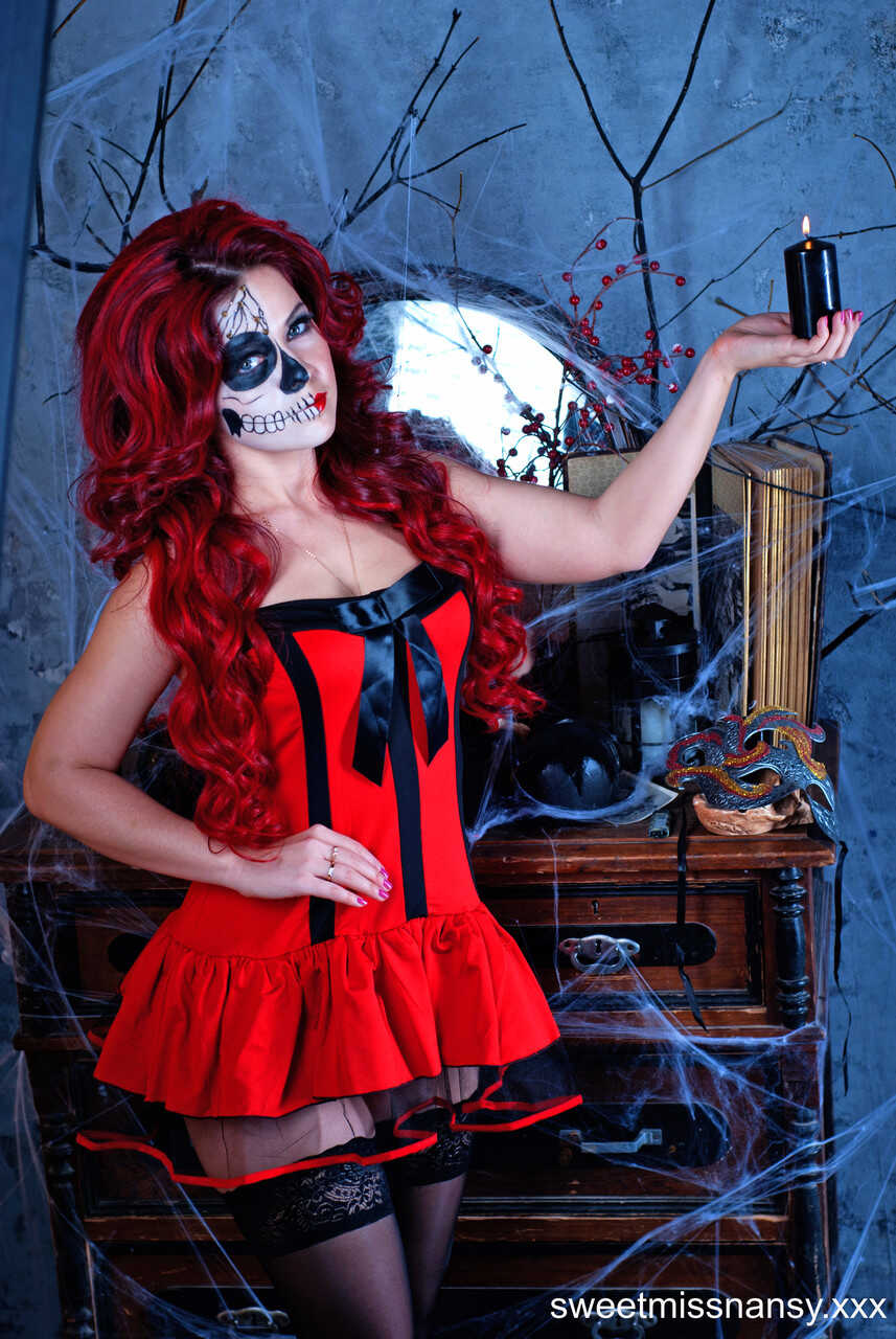 Busty Redhead Yummy Alice Shows Off Her Curves in a Sexy Costume on Halloween Night - Yummy Alice