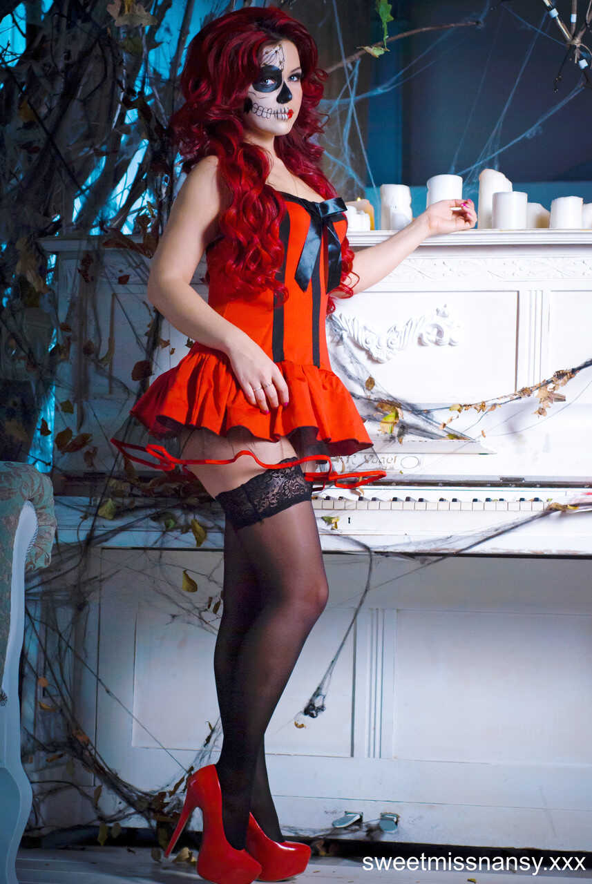 Busty Redhead Yummy Alice Shows Off Her Curves in a Sexy Costume on Halloween Night - Yummy Alice