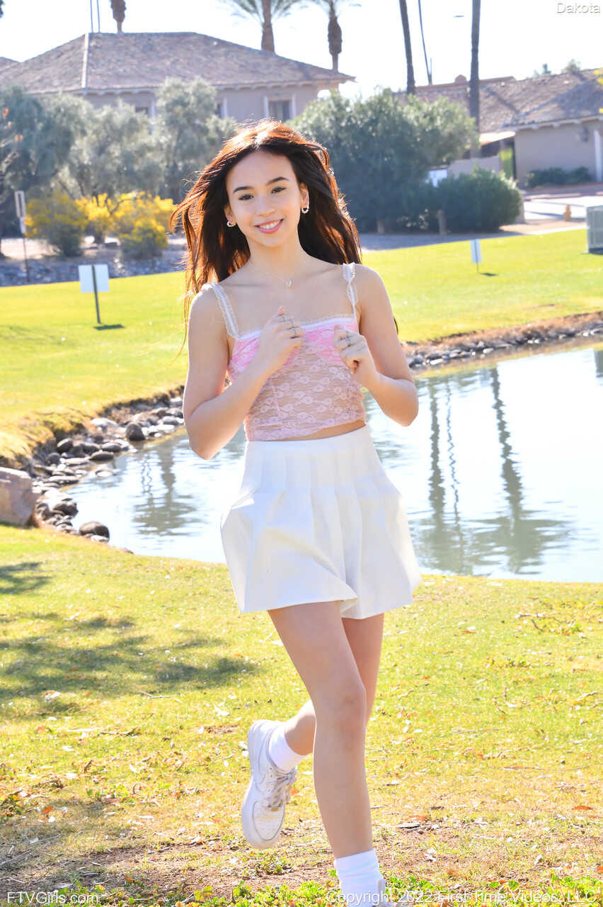 Sneaker-Wearing Amateur Babe Dakota Tyler Unveils Her Tiny Tits and Does a Handstand by the River in 'Hot Naked Women...