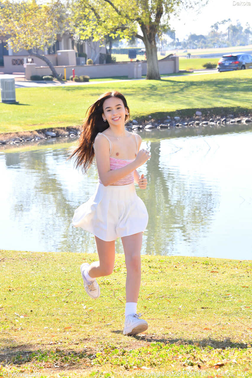 Sneaker-Wearing Amateur Babe Dakota Tyler Unveils Her Tiny Tits and Does a Handstand by the River in 'Hot Naked Women...