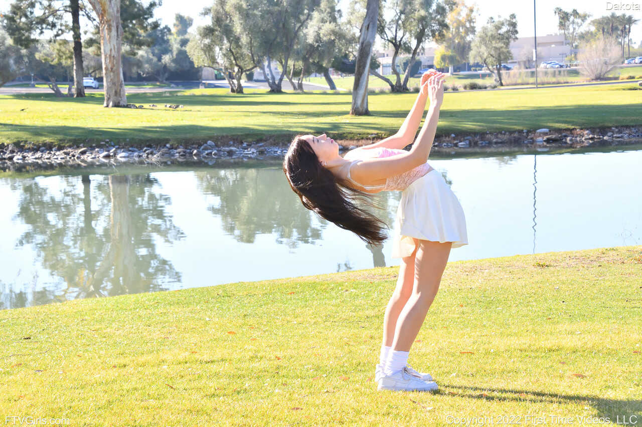 Sneaker-Wearing Amateur Babe Dakota Tyler Unveils Her Tiny Tits and Does a Handstand by the River in 'Hot Naked Women...