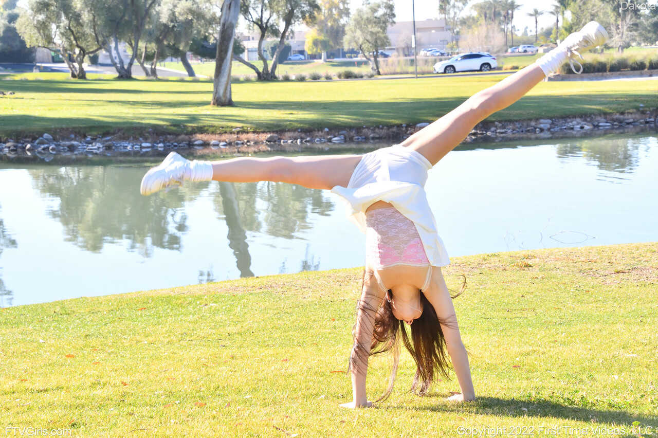 Sneaker-Wearing Amateur Babe Dakota Tyler Unveils Her Tiny Tits and Does a Handstand by the River in 'Hot Naked Women...