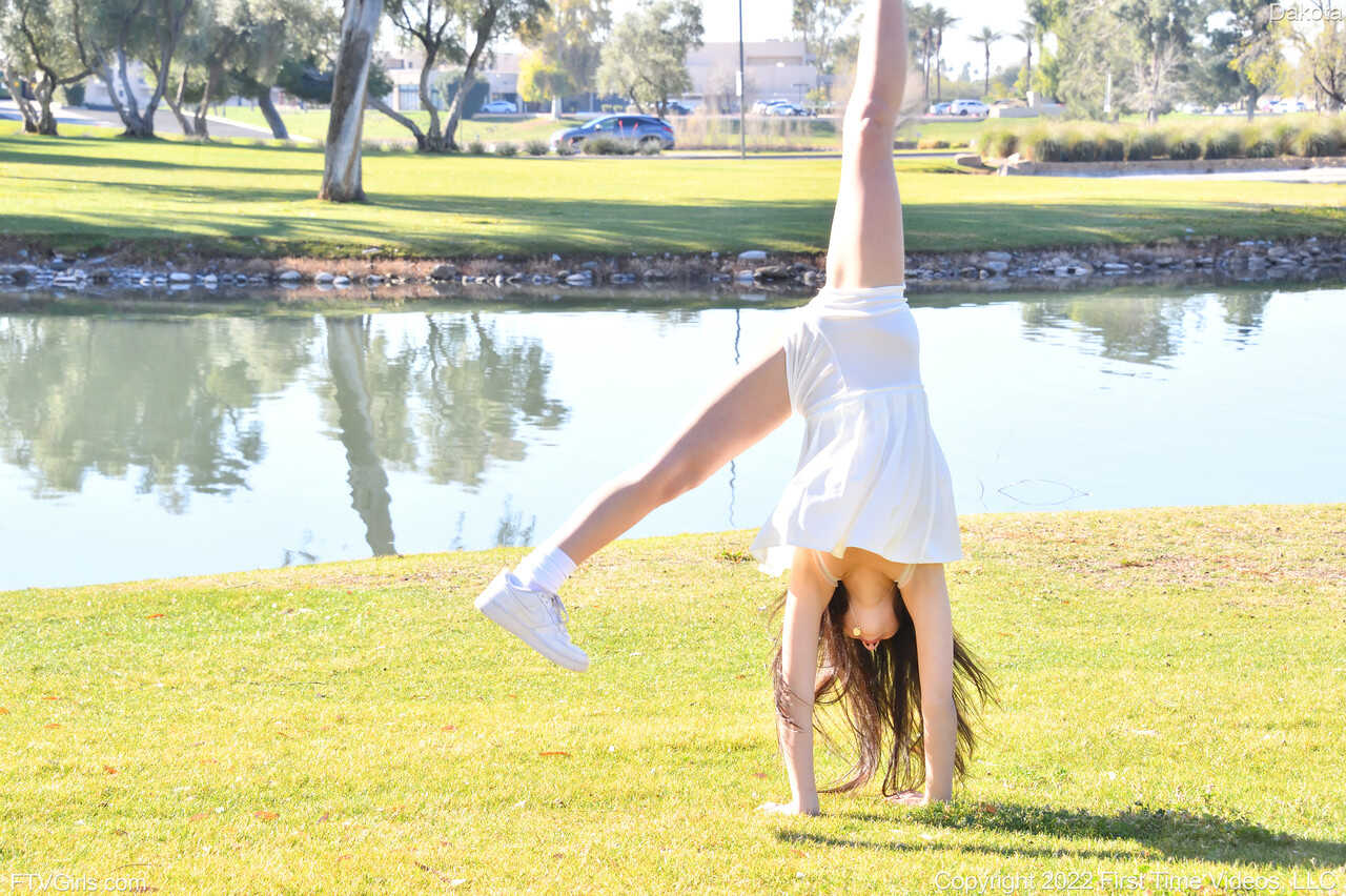 Sneaker-Wearing Amateur Babe Dakota Tyler Unveils Her Tiny Tits and Does a Handstand by the River in 'Hot Naked Women...