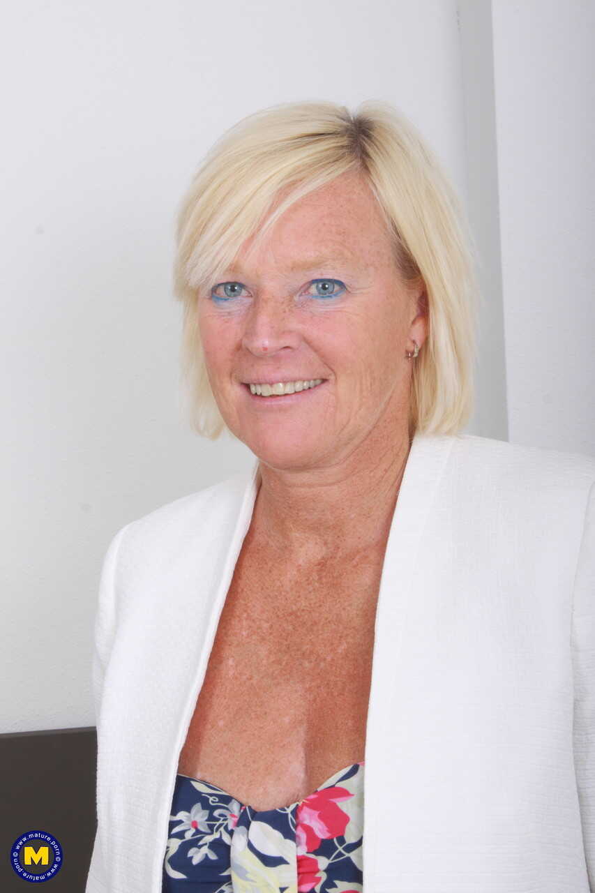 Blue-eyed granny Sabine W spreads her legs wide and teases her mature pussy with a chubby dildo. - Sabine W