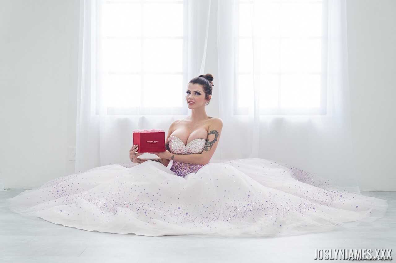 Busty MILF Joslyn James unties her wedding dress to reveal her massive cleavage - Joslyn James