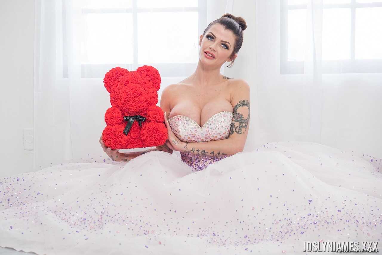 Busty MILF Joslyn James unties her wedding dress to reveal her massive cleavage - Joslyn James