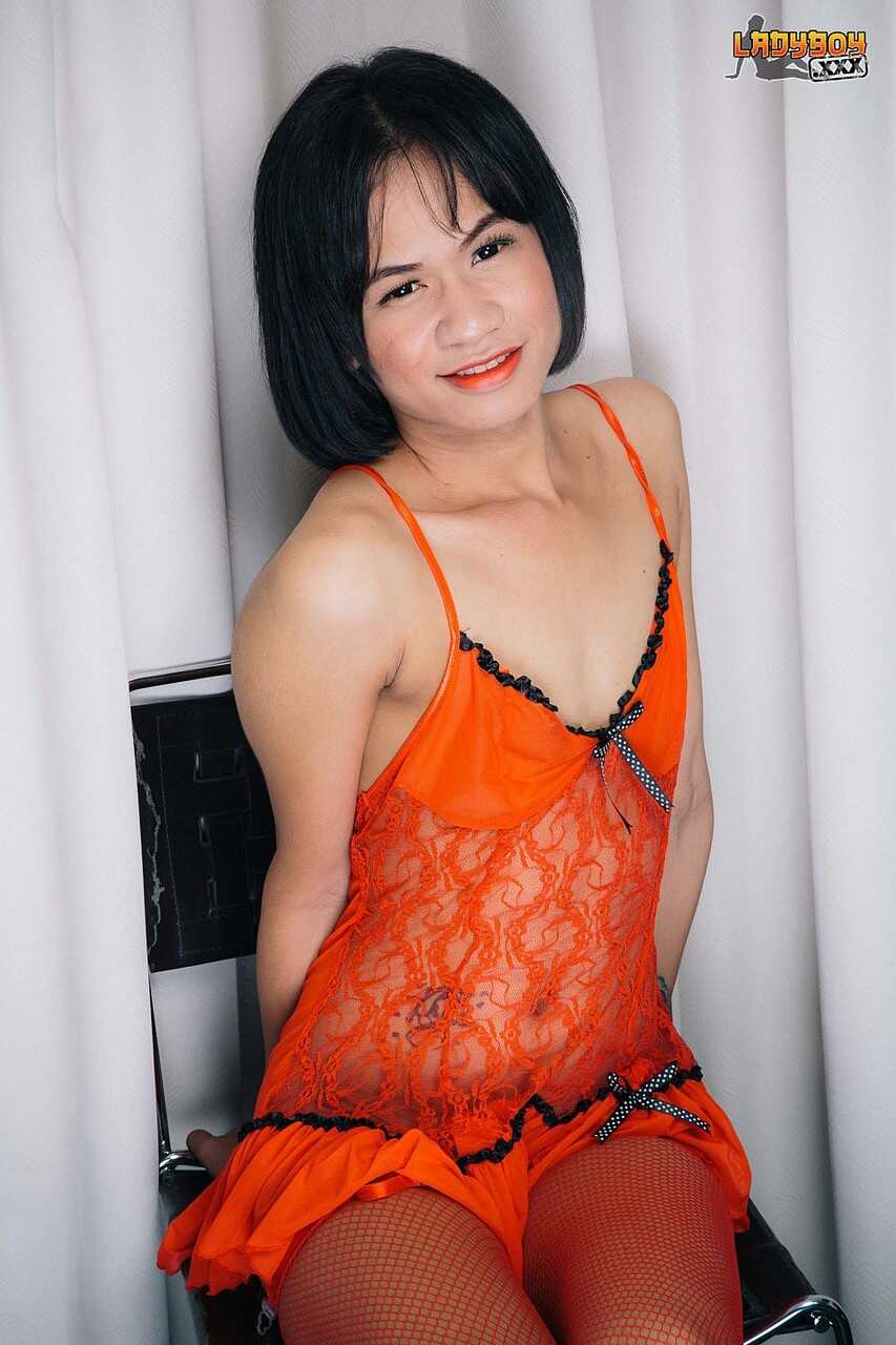 Asian TGirl Shemale Oui  A hot ladyboy with a dildo in her ass poses for the camera while moaning in pleasure. - Oui