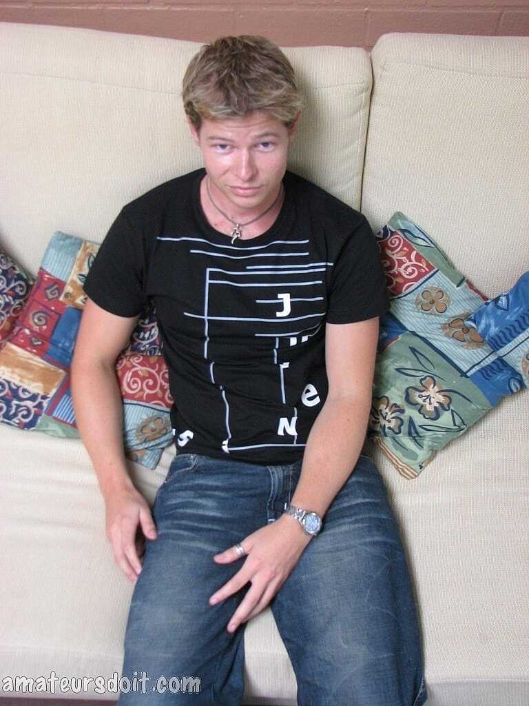 Blonde gay Paul Pounder strips completely naked and jerks off on the couch. - 