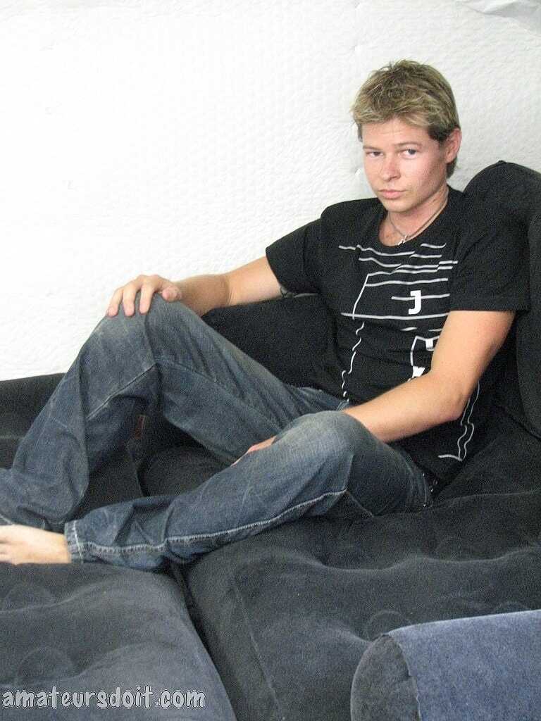 Blonde gay Paul Pounder strips completely naked and jerks off on the couch. - 