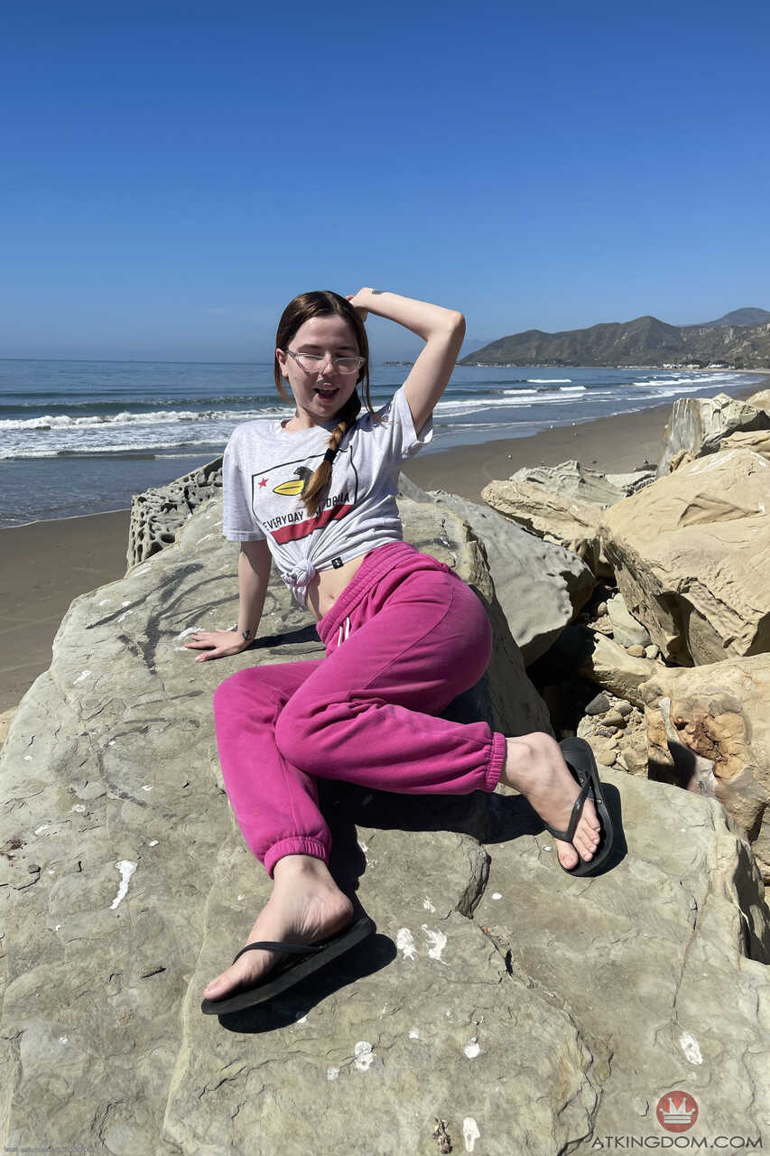 Nerdy Alina West shows off her innocent booty and freshly shaved pussy on the beach for her nerdy amateur girlfriend - Ali...