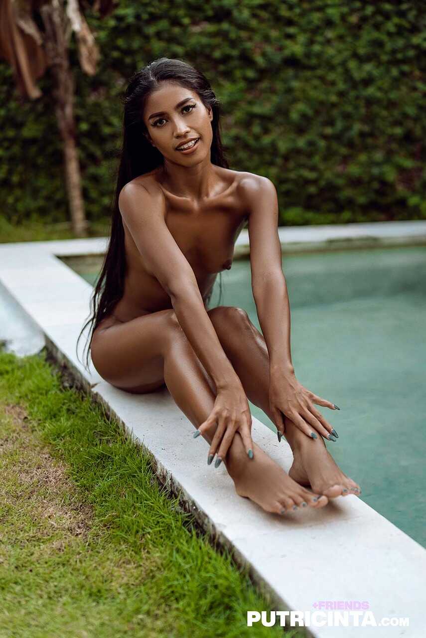 Sexy skinny babe takes a dip in the pool as she pleasures herself with a toy - Putri Cinta
