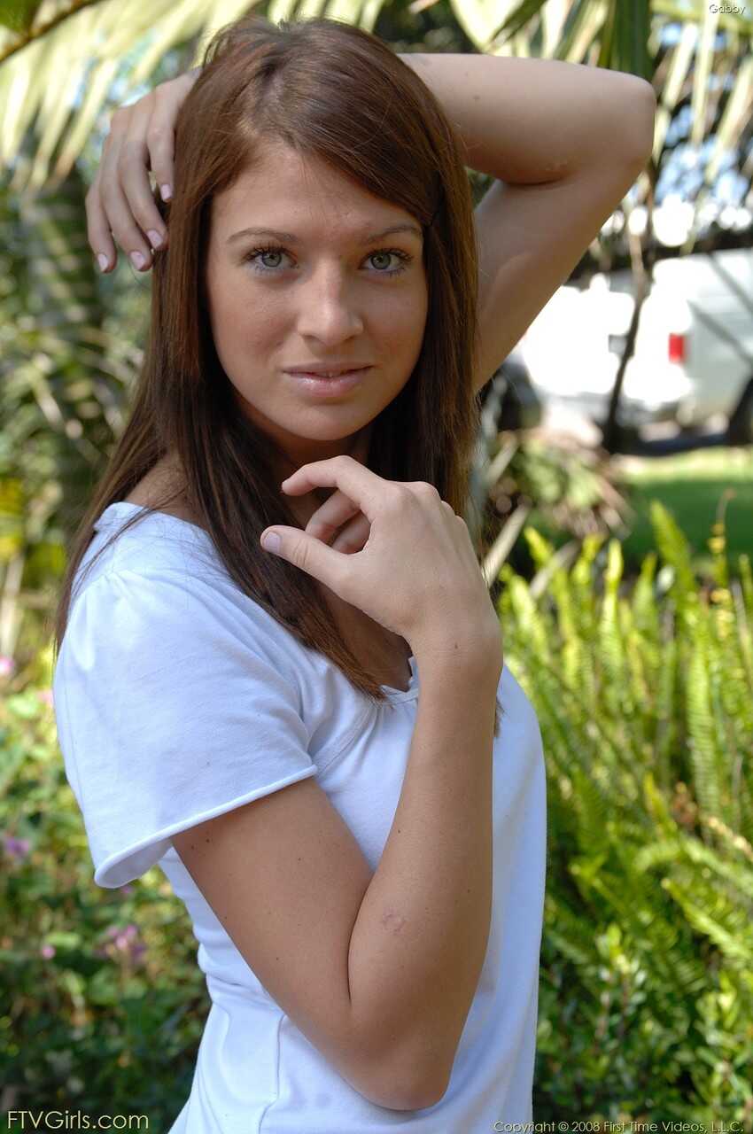 Gabby's Blue Eyes Sparkle as She Poses with a Toy in Her Cunt on the Beach - Gabby