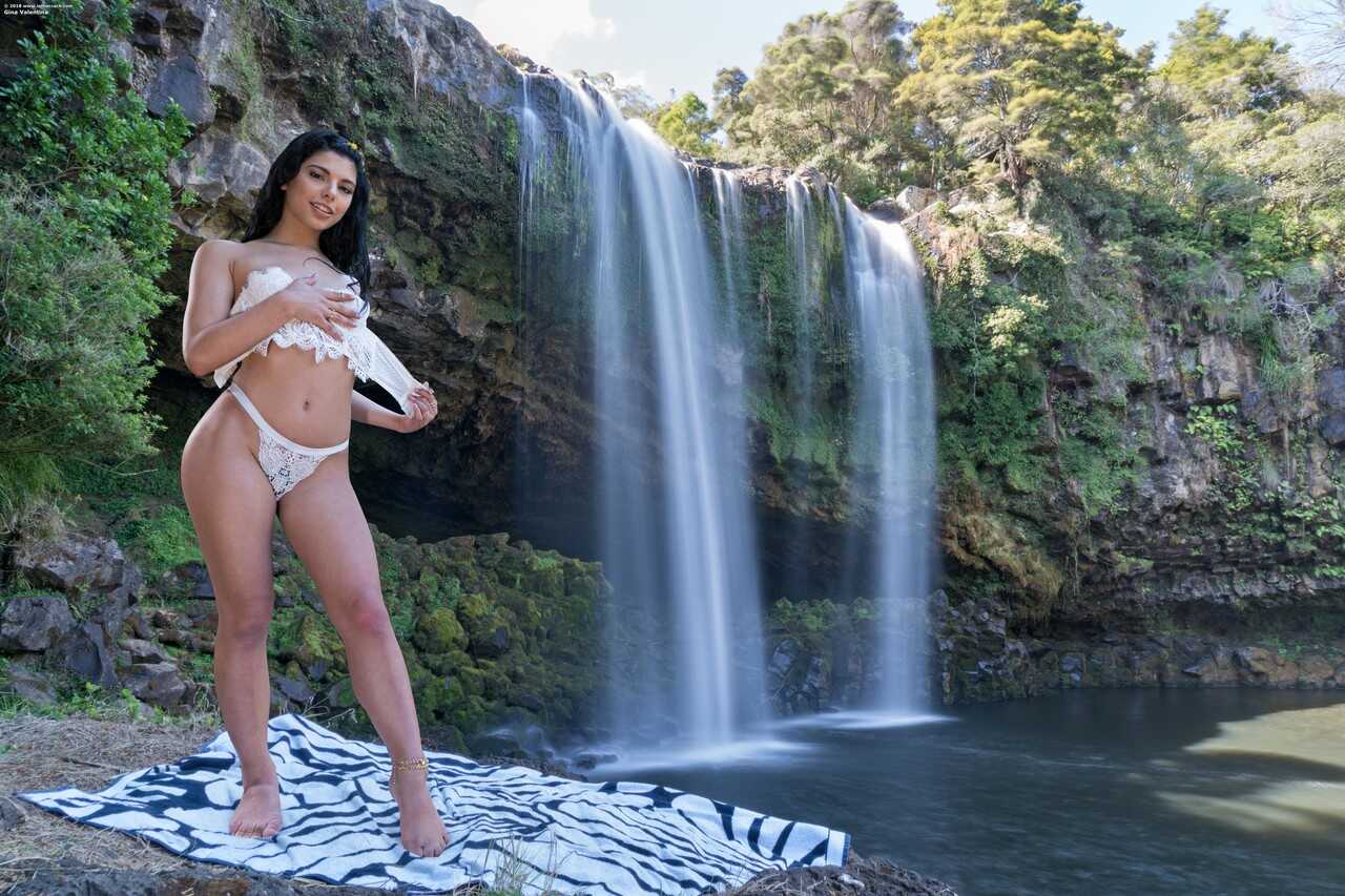 Hot Brazilian teen Gina Valentina strips down and spreads her muff by the waterfalls while showing off her latina ass and ...