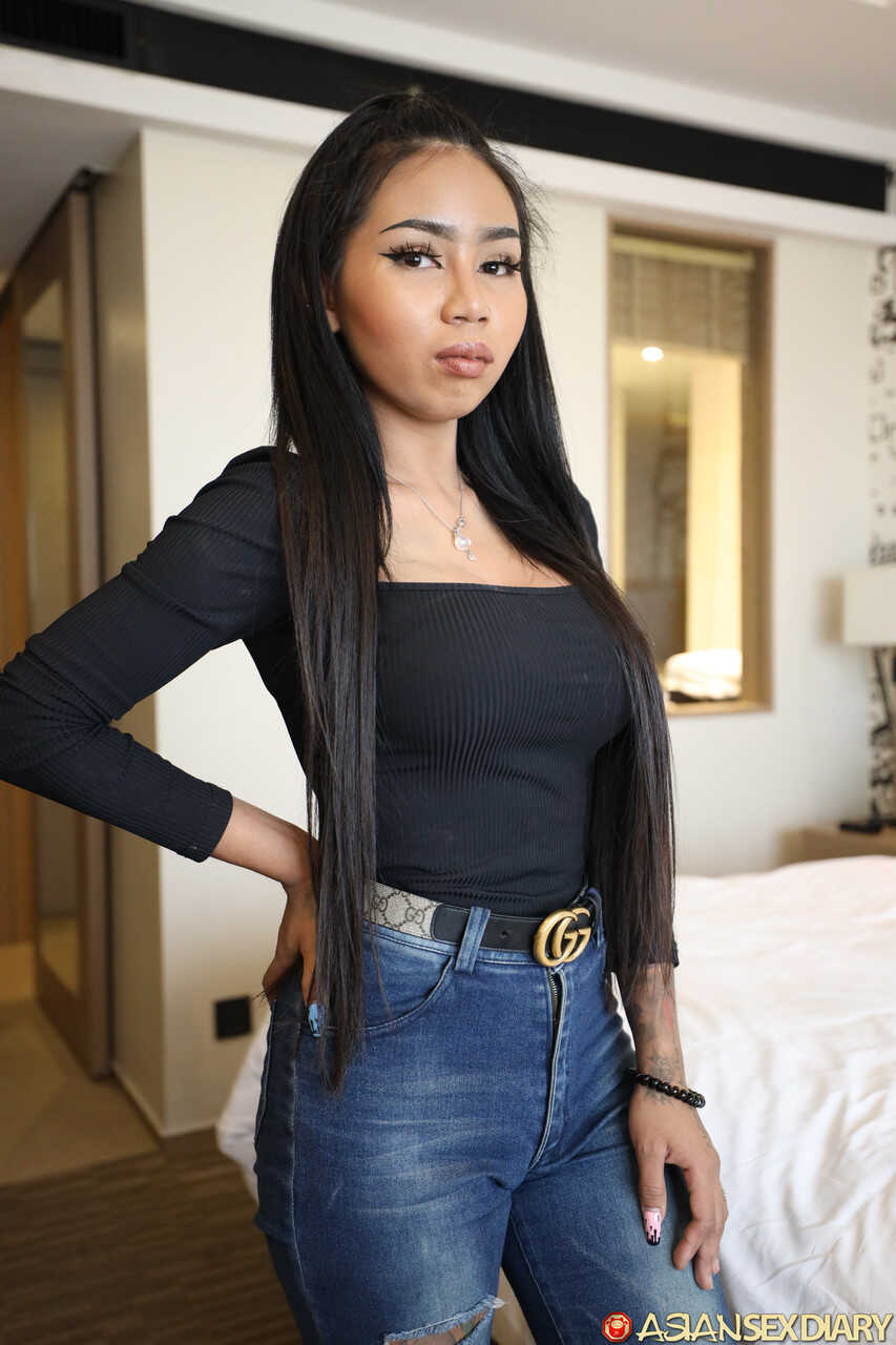 Sara's Seductive Secret: A Tiny Asian Tease with Jumbo Melons and Black Lingerie - Sara