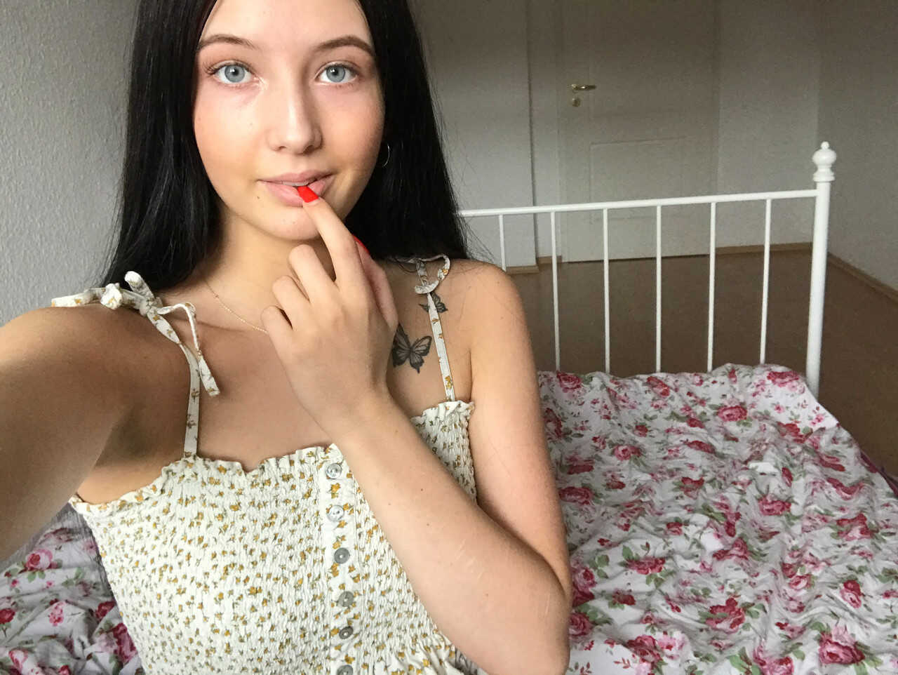 Horny teen bares it all in a seductive striptease for the camera