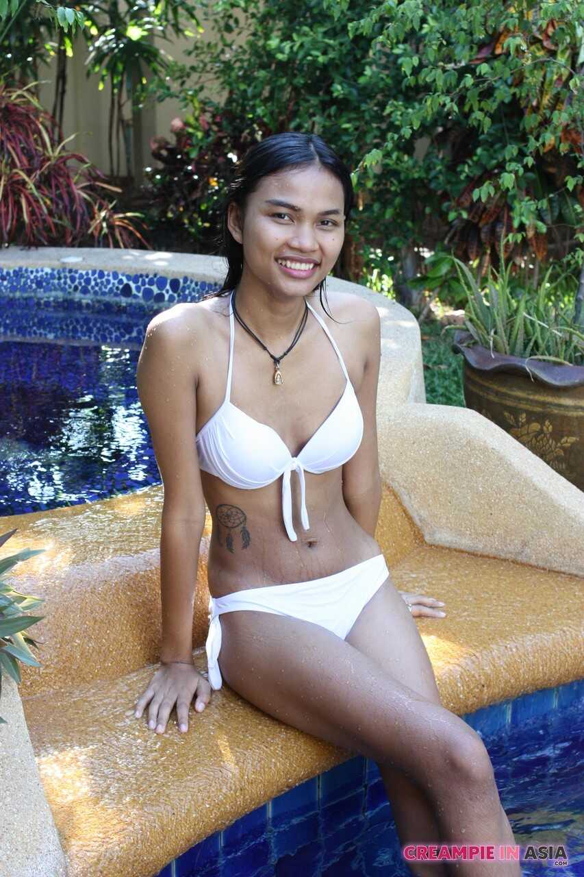 May's Breathtaking Striptease in the Pool: An Asian Beauty's Sexy Bikini Showcase