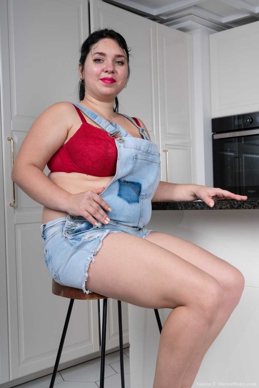 Chubby brunette amateur Tanita exposes her large boobs and toys herself with her hairy pussy - Tanita