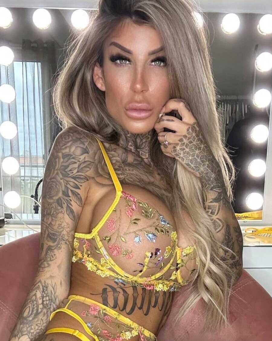 Tatted Goddess Jacky Strips Down to Her Yellow Lace Lingerie for a Fiery Photoshoot