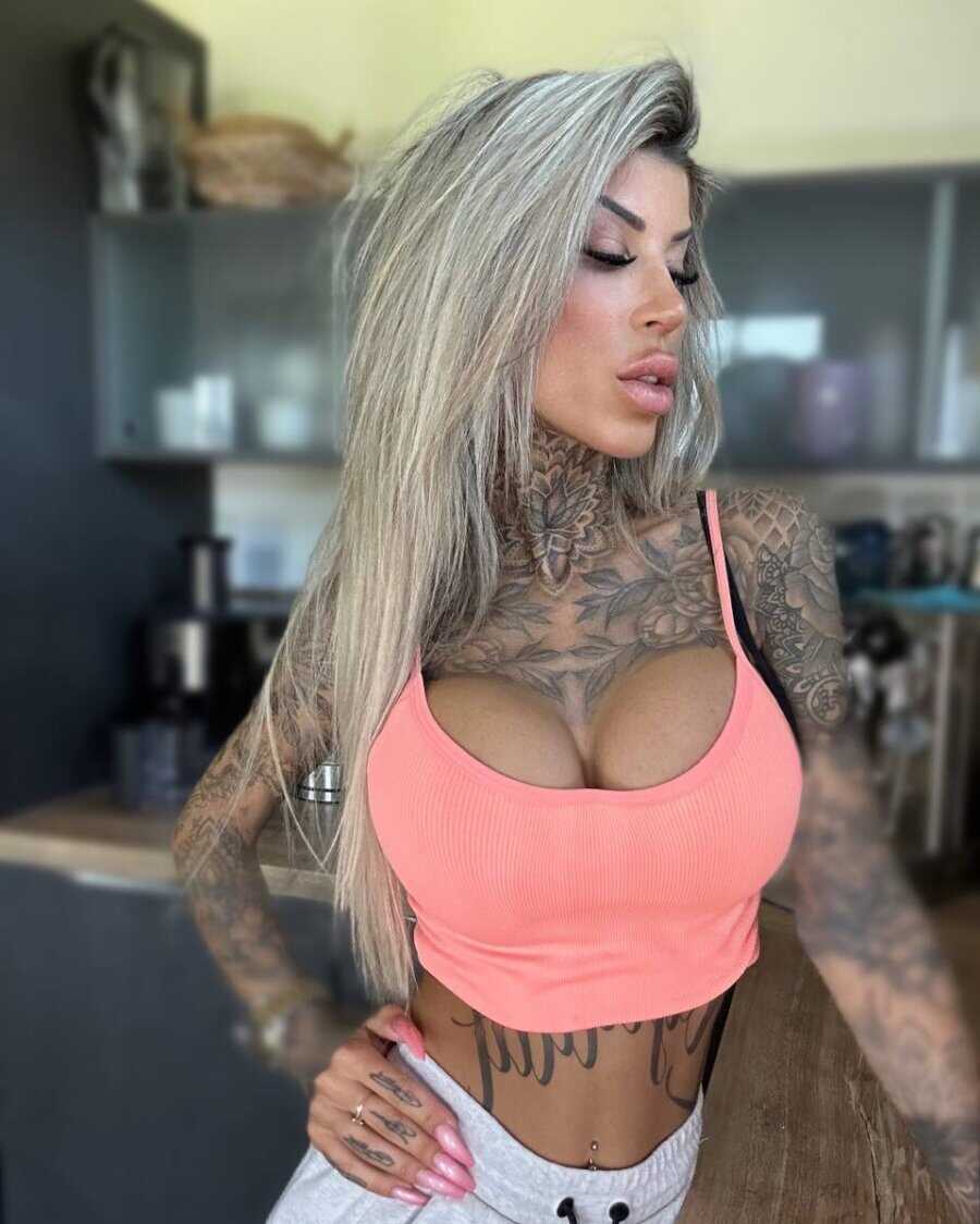 Tatted Temptress Shows Off Her Juicy Melons