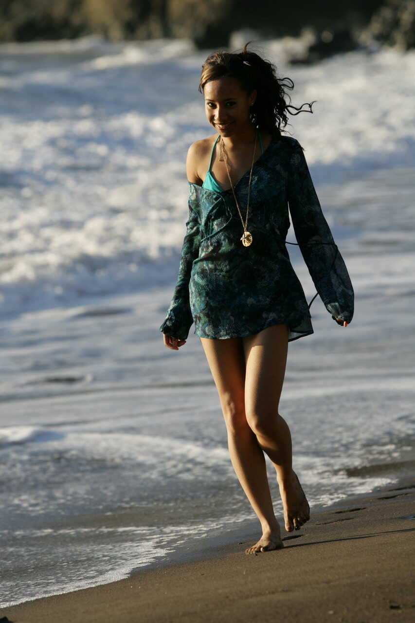 All-natural teen model Toni walking in her sexy outfit on the sandy beach