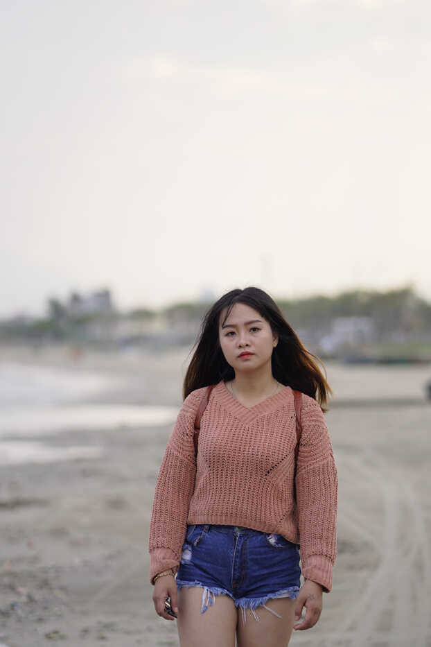 Exotic Asian beauty struts in teeny denim shorts and comfy sweater, steaming up the streets!