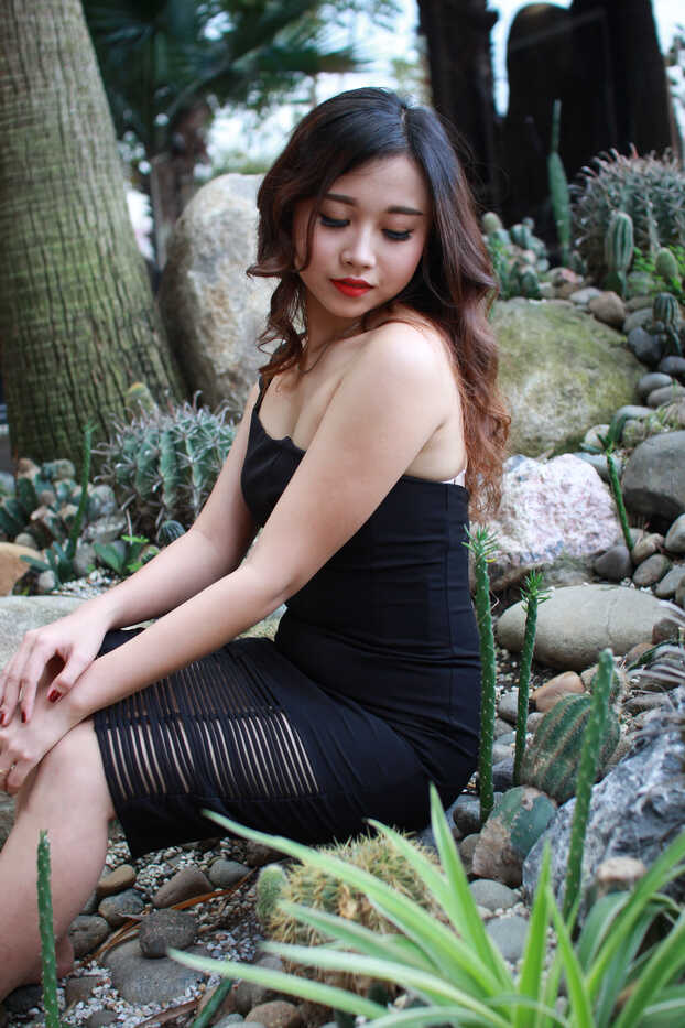 Skinny Asian Tease in Black Summer Dress: Showing Off Her Long Legs